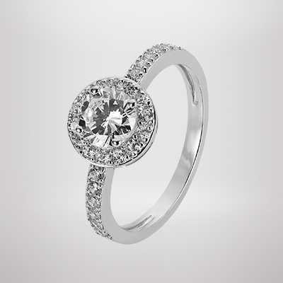 A Revere Sterling Silver Cubic Zirconia Halo Ring in size N.