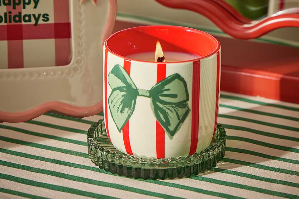 A green diffuser set on a table.