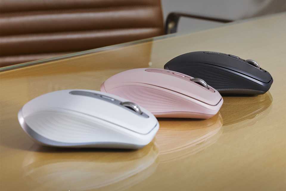 Three Logitech wireless mice in different colours.