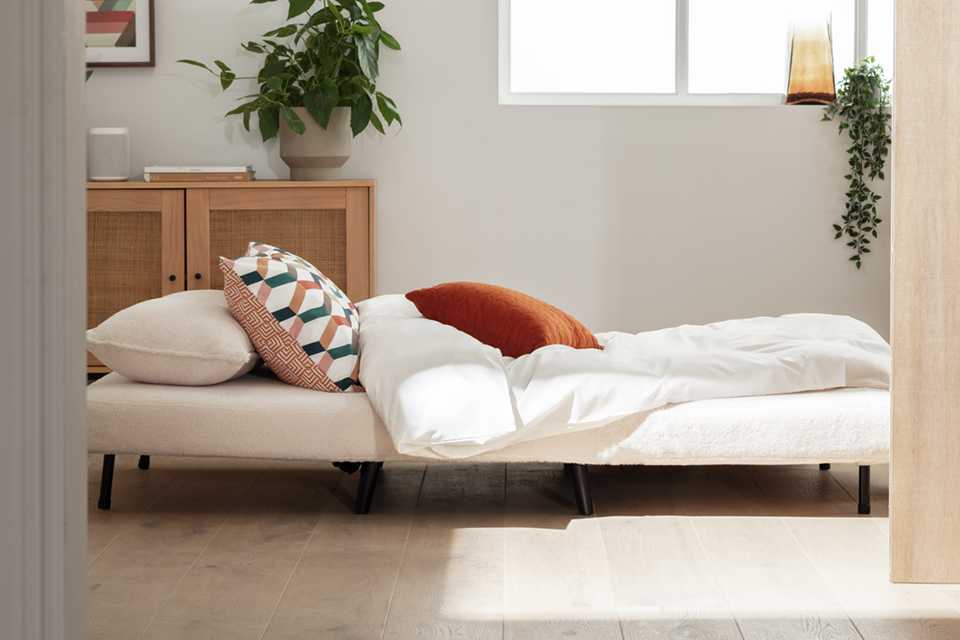 A Habitat Roma small double bouclé chairbed open in a room.
