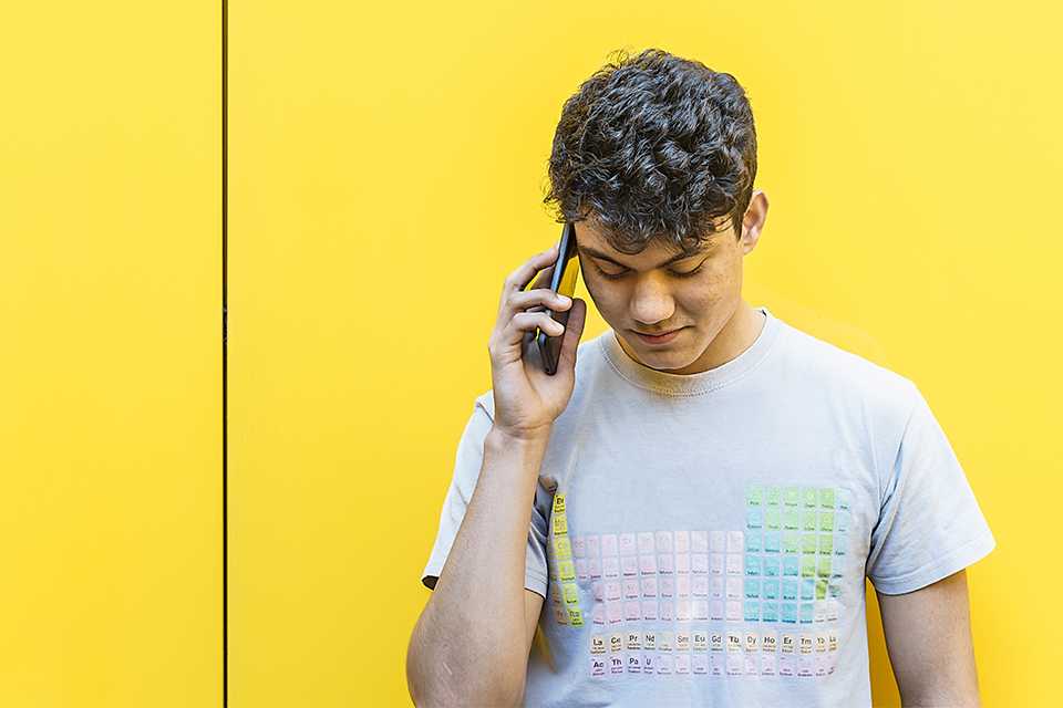 A boy talking to someone on a call.