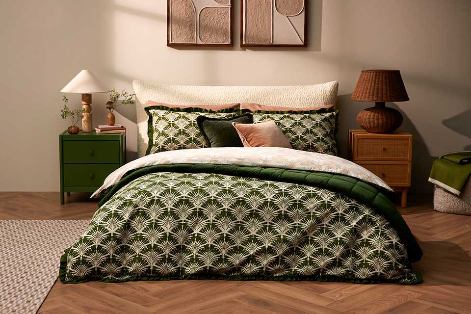 Green patterend Argos bedding on cream bed frame in bedroom.