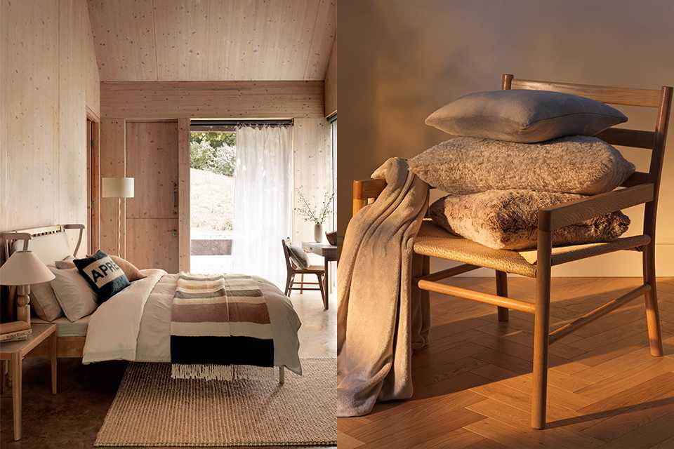 Cosy wooden bedroom with throws and cushions then a close up of a wooden accent chair with fur pilled cushions and cream throw draped over arm.