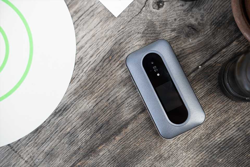 Doro Leva L30 clamshell feature phone placed on a wooden table.