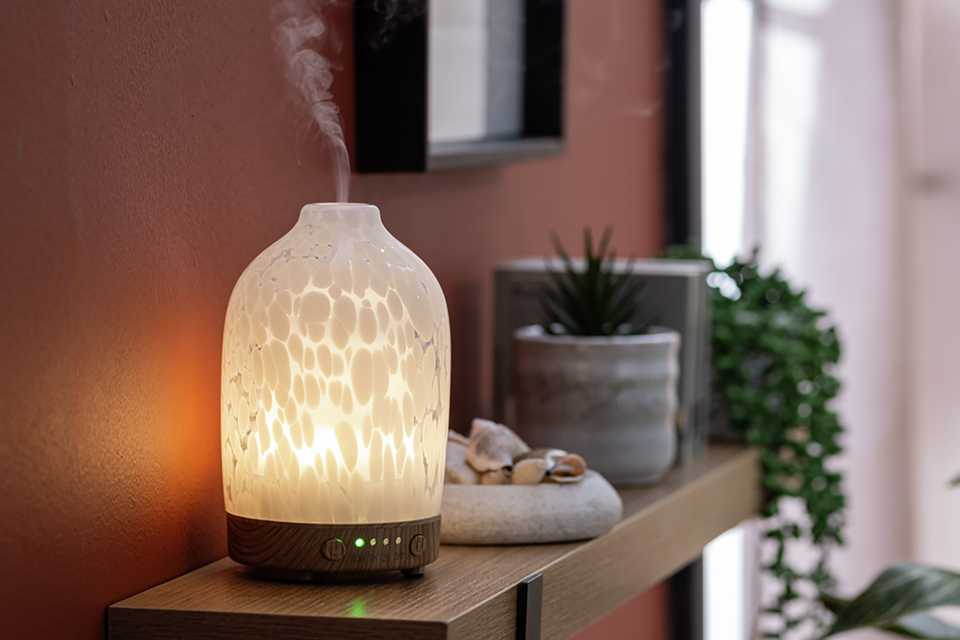 Glass white room difuser in living room.