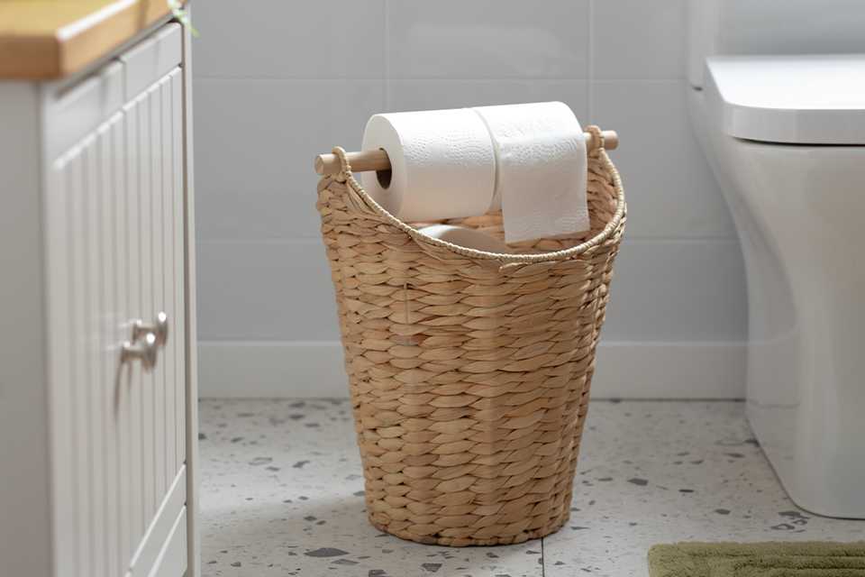 A tissue roll on a Habitat Woven Toilet Roll Holder.