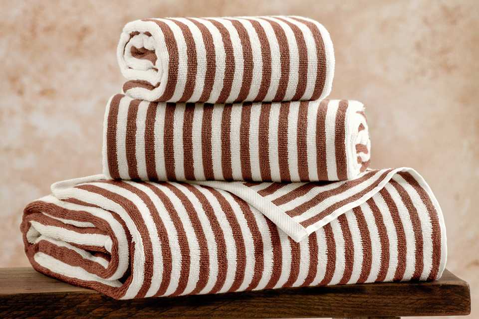 Yard Hebden Stripe Bath Towel set on a table.