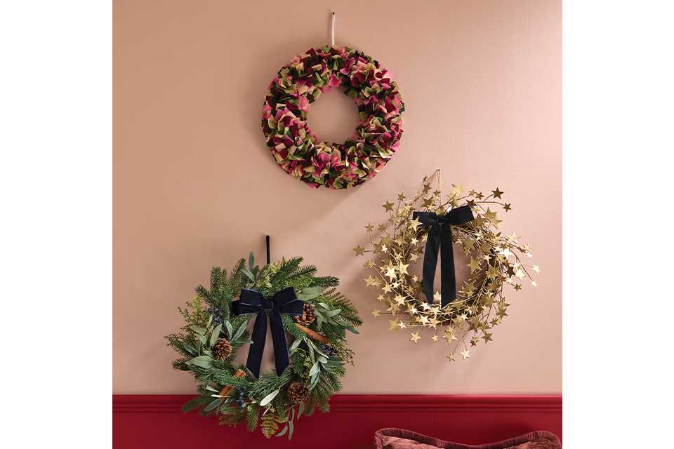 3 wreaths on a wall