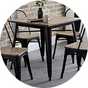 A Julien Bowen Grafton square dining table with some chairs.