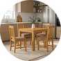 A Walplus wooden dining table next to matching wooden chairs.