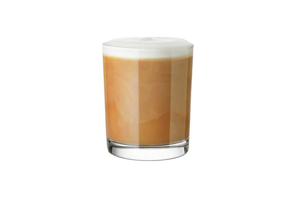 A glass of flat white coffee.