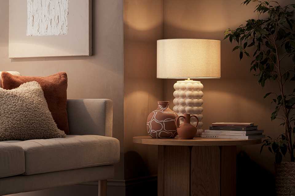 A table lamp on a side table.