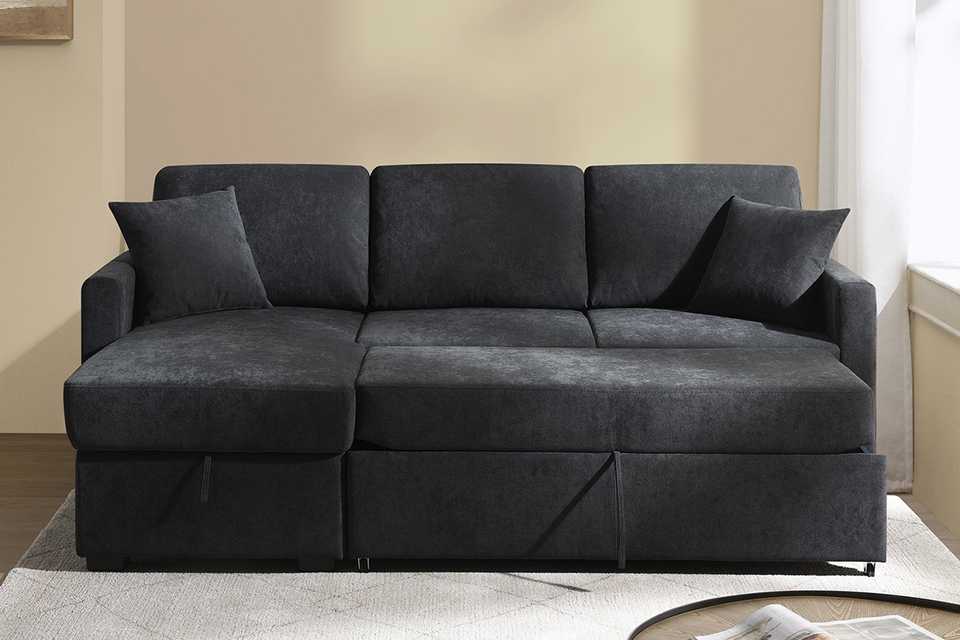 A Habitat black sofa bed in a living room.