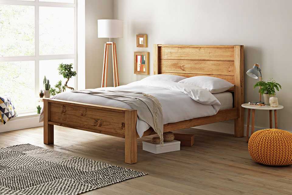An Argos Home Fairfield pine double wooden bed frame.