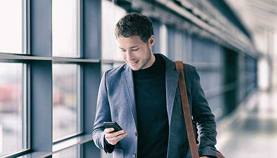 a picture of a man holding a payment card.