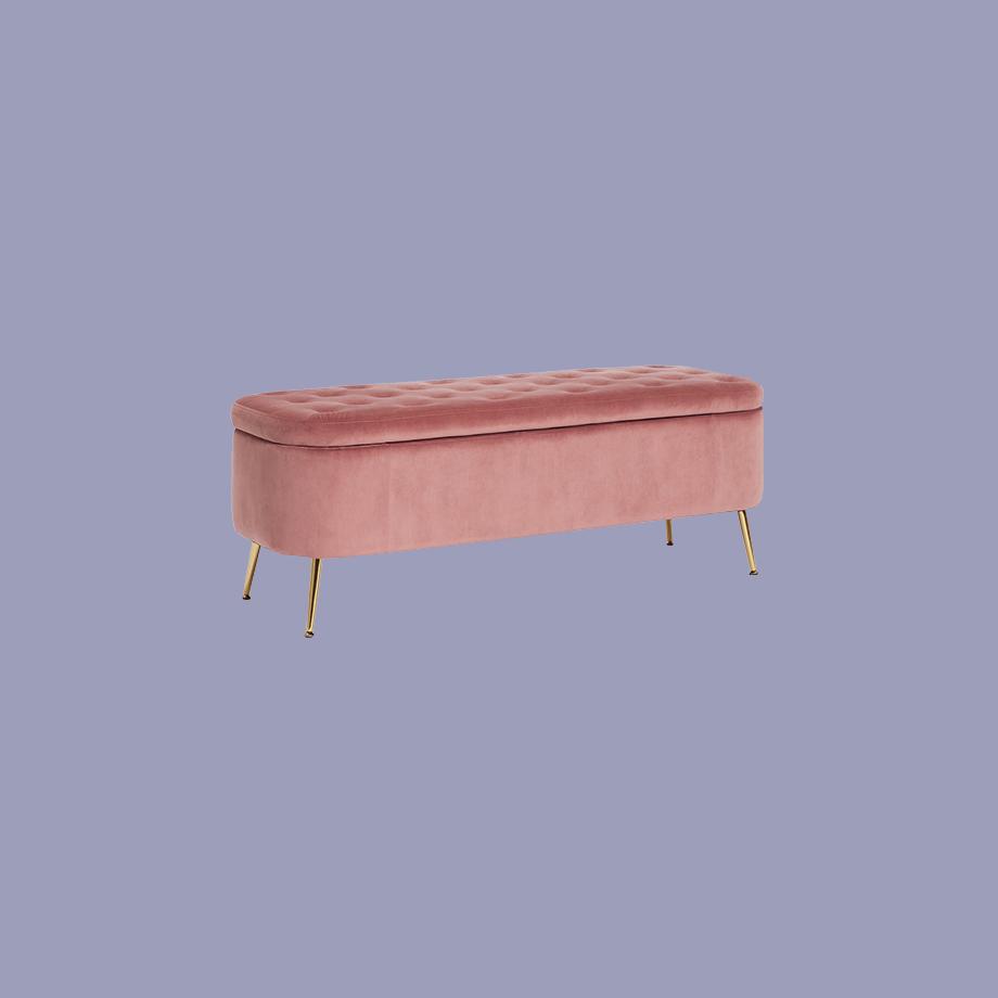 Pink velvet ottoman with golden metal legs.