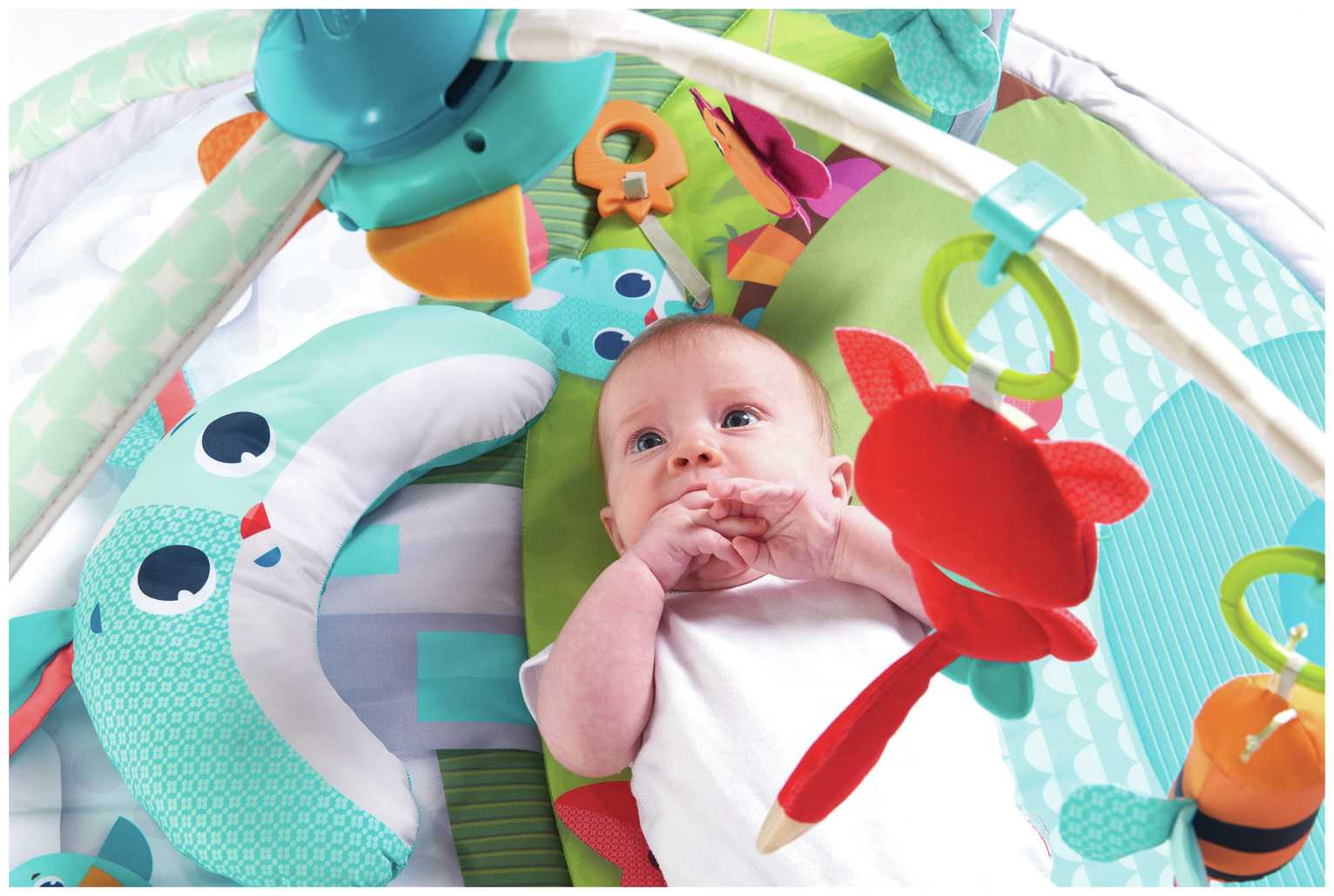 A baby on a playmat.