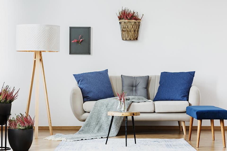 Sofa with navy cushions.
