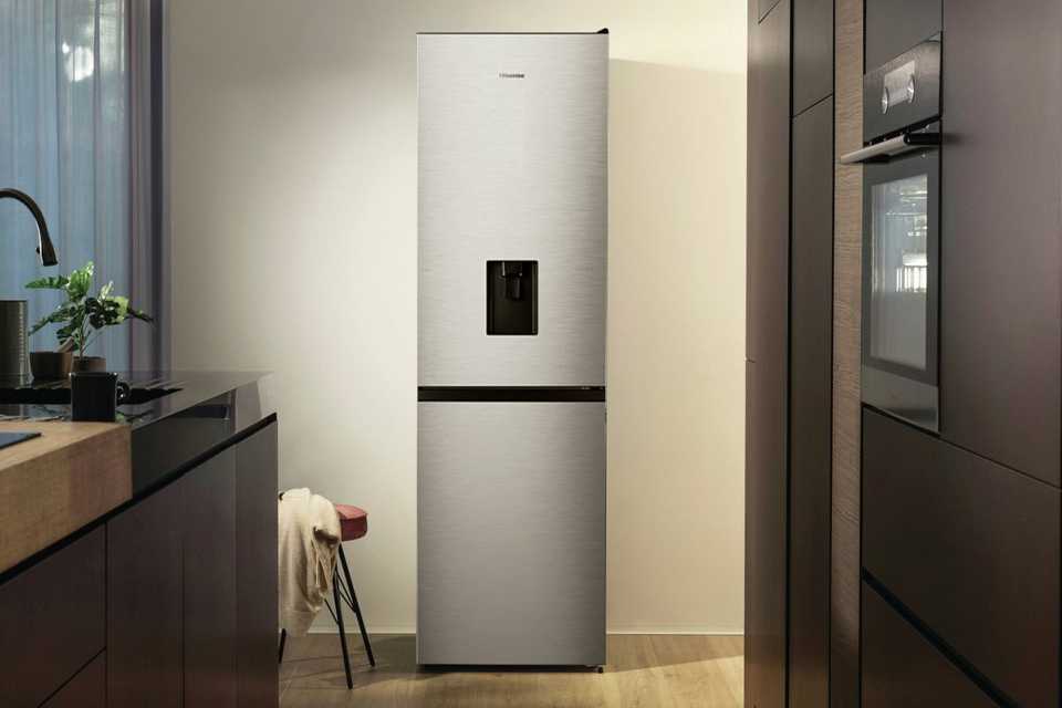 Hisense RB390N4WCE Freestanding Fridge Freezer in silver colour placed in a kitchen.