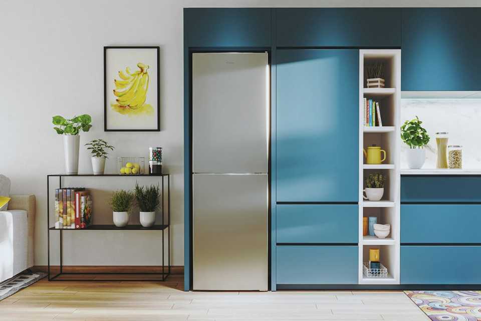 Candy CCT3L517ESK 1 silver fridge freezer in a kitchen.