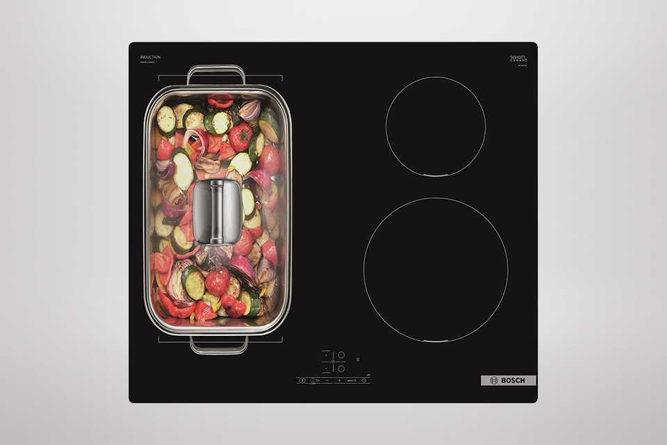 A large pan of food on a hob.