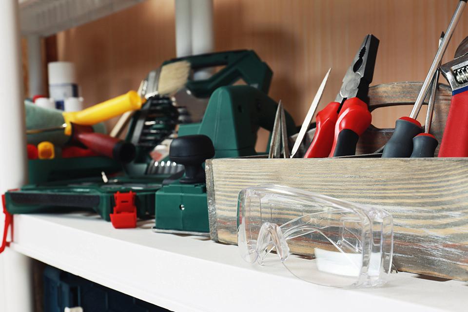 Selection of tools on shelf.