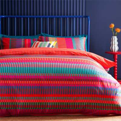 Colourful striped patterned bedding.