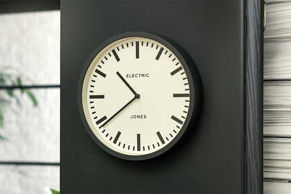 Jones Electric Wall Clock in grey colour.