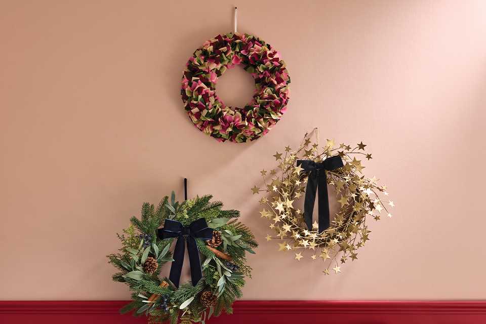 3 wreaths on a wall