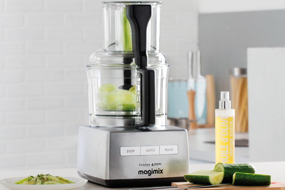 Fruit and vegetables in a juicer.