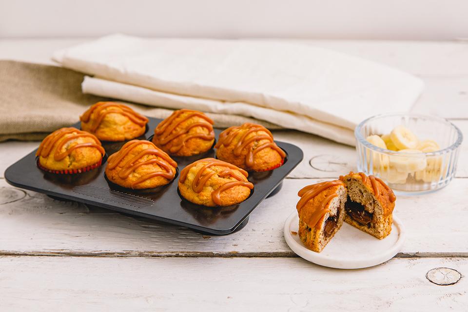 Freshly baked cakes in a cake tin.