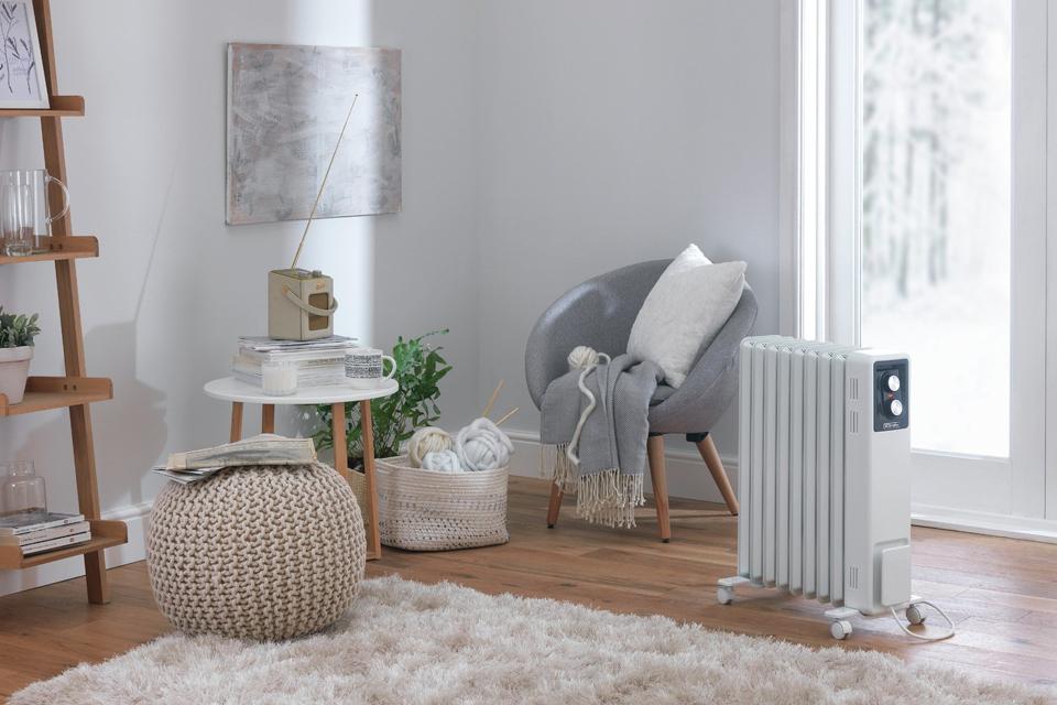 Portable heater on floor in living room.