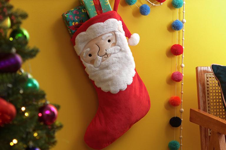 Santa design Christmas stocking with gifts inside.