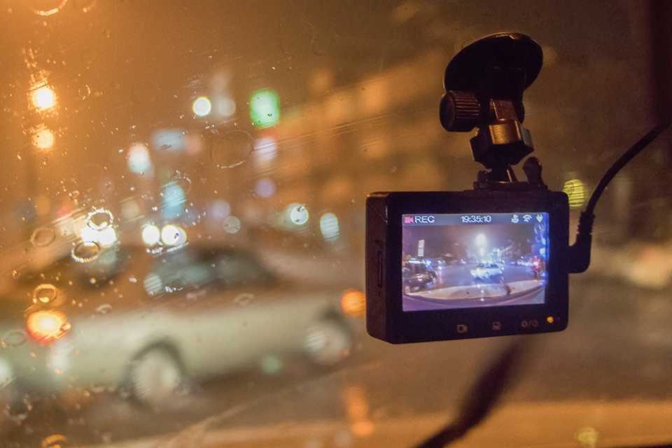 Image of front dash cam recording a rainy drive.