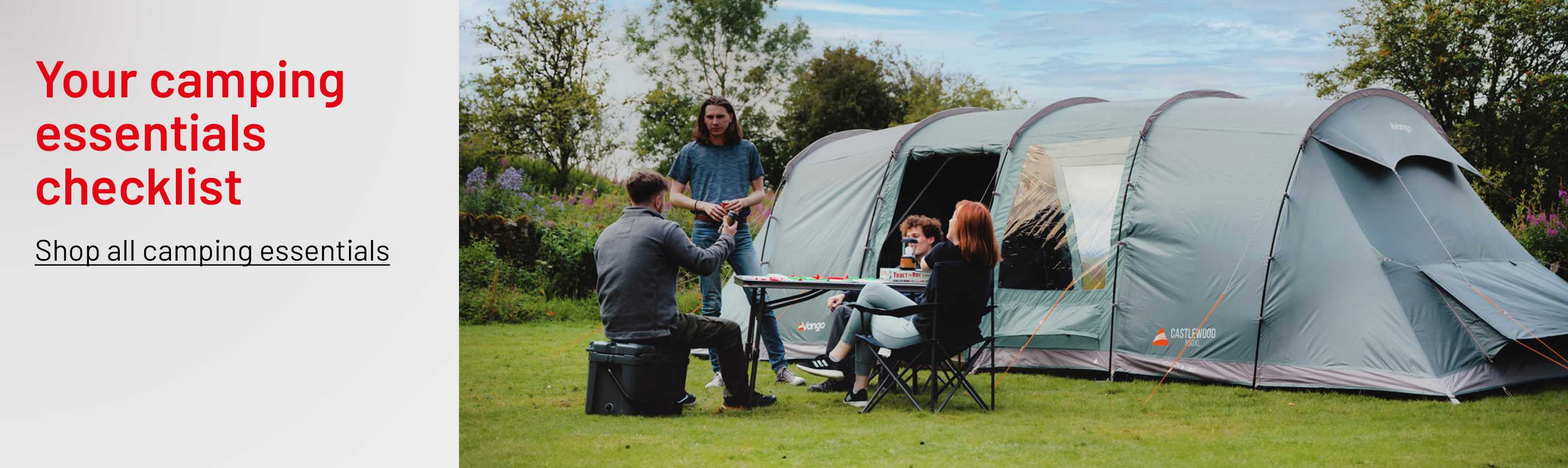 A group of friends sitting outside Vango Castlewood 8 person Tent.