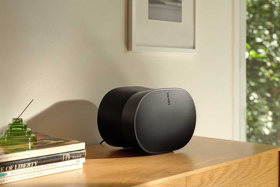 A Sonos Era 300 black speaker placed on a table.