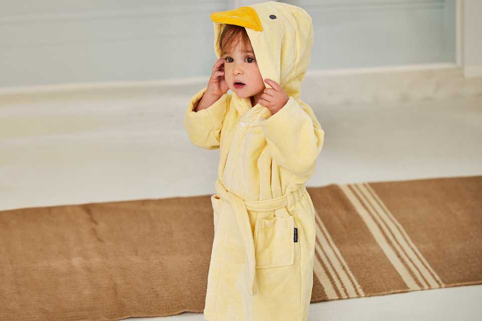 A toddler boy in a JOJO MAMAN BÉBÉ Duck Towelling robe 1-2 years.