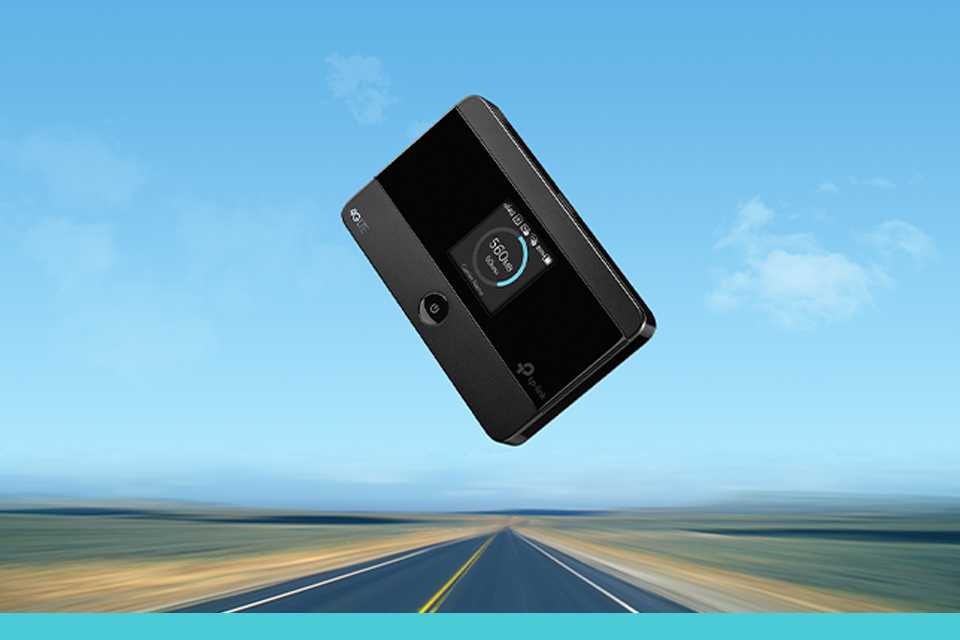 TP-Link 4G mobile travel router against an open road background.