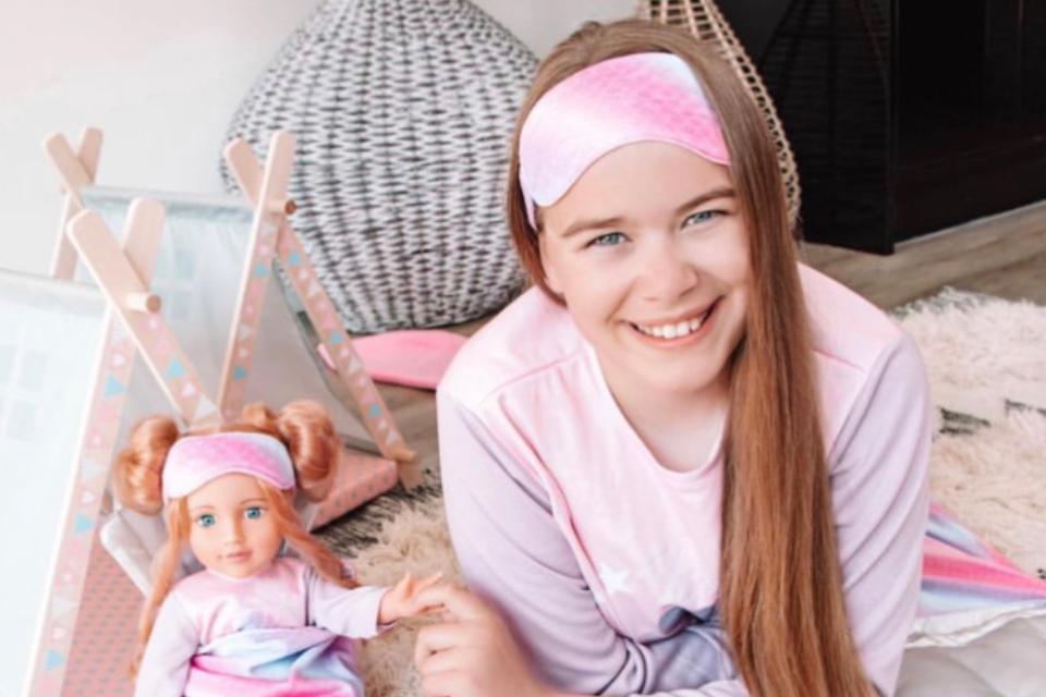 Little girl with DesignaFriend doll.