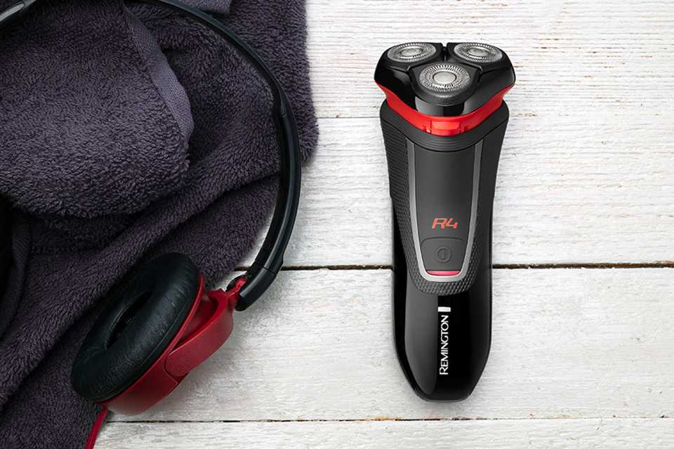 A black and red Remington rotary shaver.