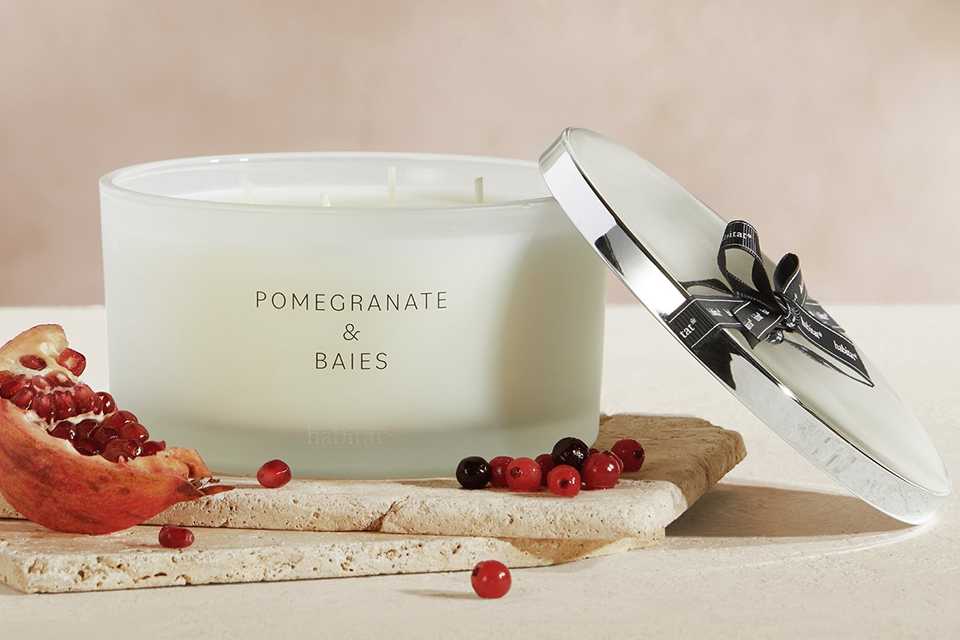A Habitat Pomegranate & Baies XL candle with lid.
