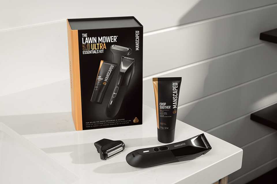 Shot of the Manscaped Lawn Mower 5.0 Ultra packaging, shaver, head and cream on a bathroom table.