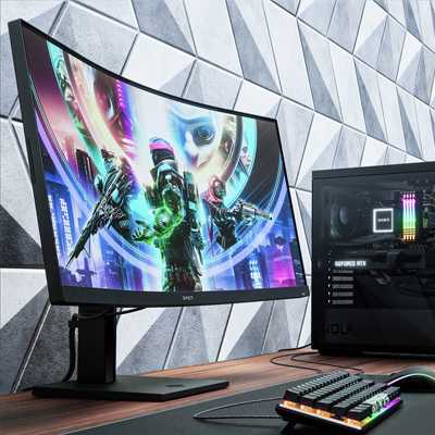 HUAWEI MateView GT 34 inch 165Hz gaming monitor on a gaming desk.