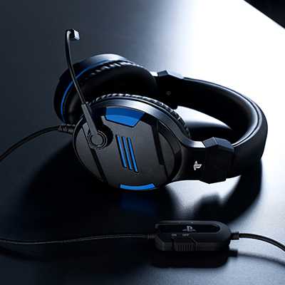 A girl playing video game on a console wearing headsets.