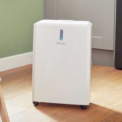 Dimplex 14 Litre Dehumidifier placed in a laundry room.