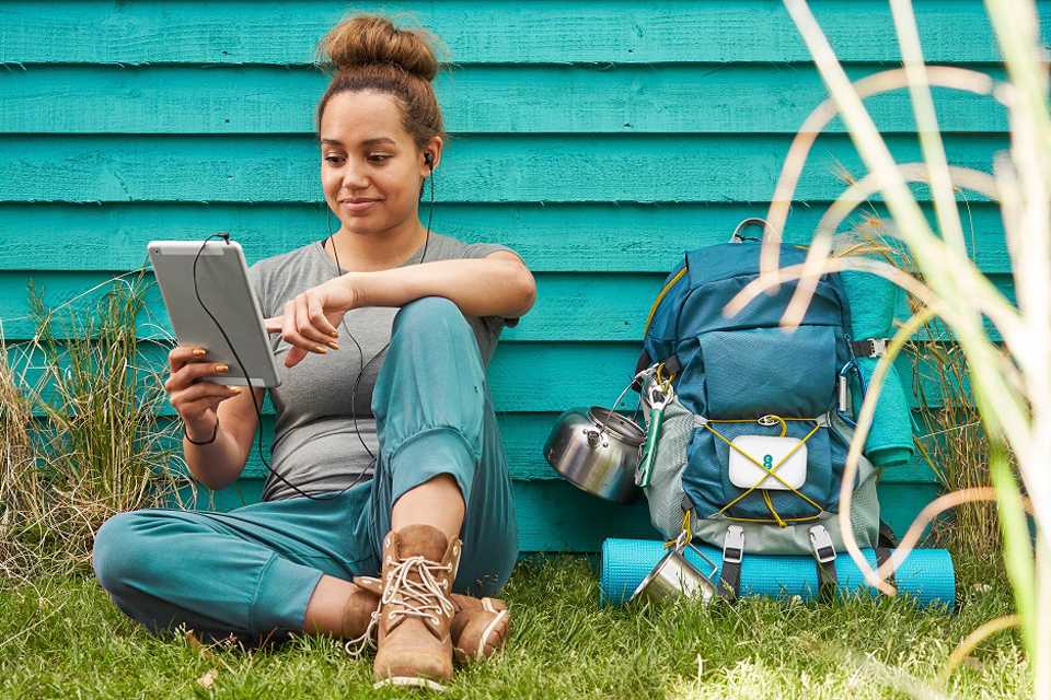 A girl streaming something on her tablet.