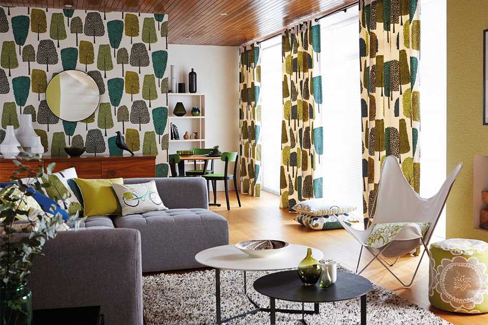 Scion cedar forest green wallpaper in an open plan living space.