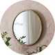 A Habitat Mango Wood Round Wall Mirror.