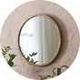 A Habitat Mango Wood Round Wall Mirror.