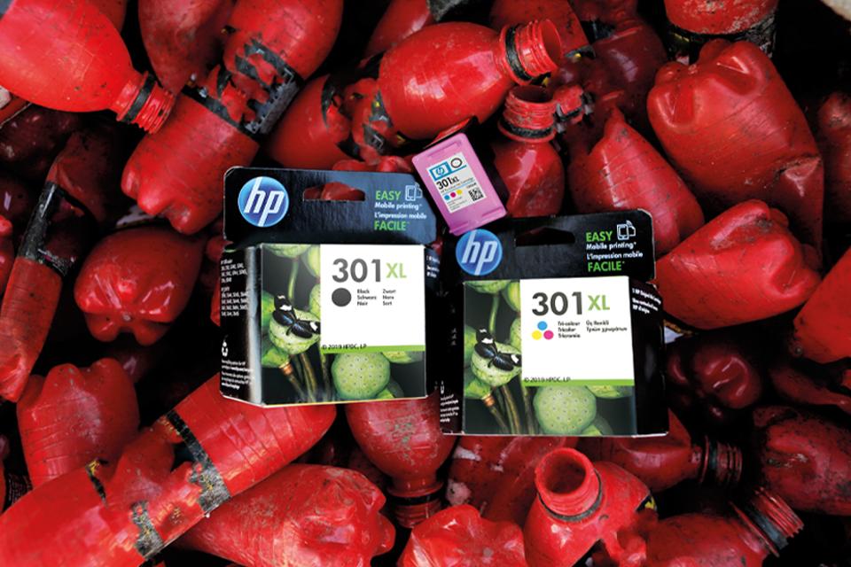 HP cartridges on top of water bottles